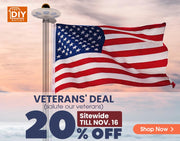 American flag on a pole with a Veterans' Day discount banner in the background
