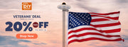 American flag on a pole with a Veterans' Day discount banner in the background